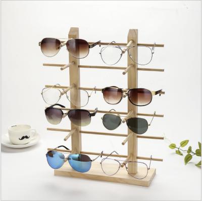 China 2019 Environmental Friendly Natural Wooden Sunglasses Counter Display Rack Holding 12 Pair Sunglass for sale