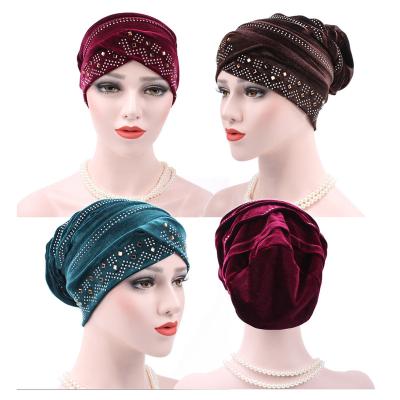 China Hot 2017 Fashions Gold Comfortable Islamic Muslim Velvet Turban Hair Drilling In Pile Hat Women Chemo Hijab Tube Running Solid Turban for sale