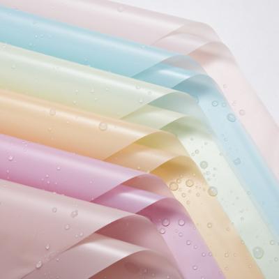 China Waterproof Wholesales Cheap PVC Paper Wrapping Solid Color Mist Side Flower Waterproof Bouquet Wrapping Paper for sale