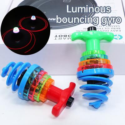 China Funny Kids Toy With Lights High Quality Hot Selling Plastic Flash Bounce Spinning Launch Gyro Top Top for sale