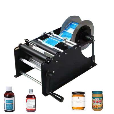 China Manual round bottle plastic sticker packing machine food MAKWELL labeling machine for sale