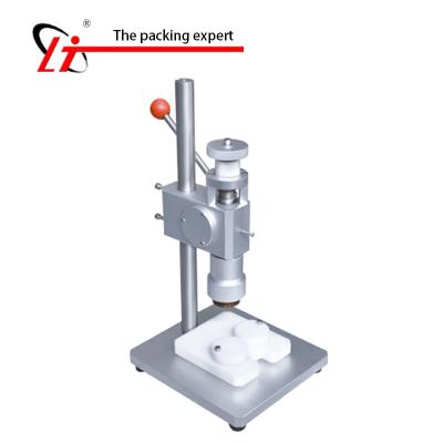 China Manual CLOTHING Perfume Tying Machine Capper Sealing Machine Metal Cap Press Capping Machine for sale