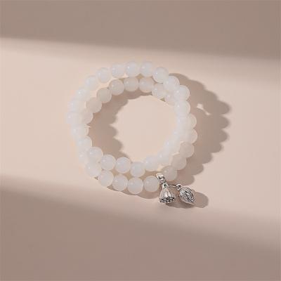 China New Arrival Durable Stretch Crystal Bracelet With Charm Healing Jade Lotus White Beads Crystal Bracelet For Women for sale