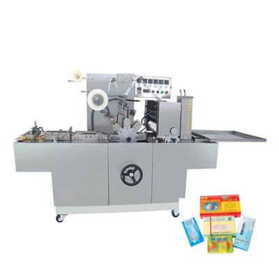 China CLOTHING Cellophane Wrapping Film Machine Suppliers For Poker Box Packaging Equipment à venda