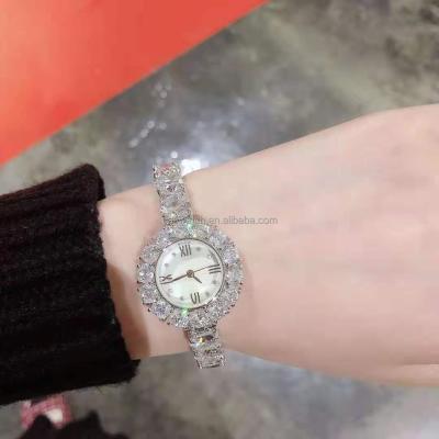 China Hot Selling Retro Waterproof Quartz Women's Diamond Display Gift Watches Stand Alloy Watch for sale