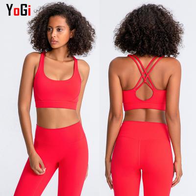 China Ladies Breathable Bright Color Sports Yoga Strappy Cross Back Bra for sale