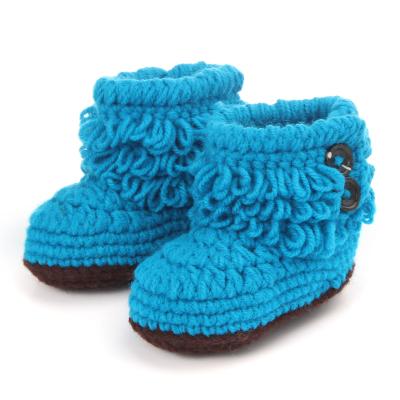 China Flat Wholesale Tassel Crochet Newborn Baby Soft Boots With Button for sale