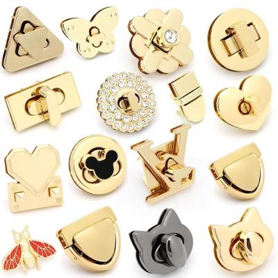 China For handbag factory custom lightweight gold alloy bag buckle locks parts turn lock hardware metal handbag lock for sale