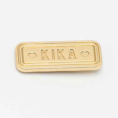 China Zinc Alloy Metal Label Custom Gold Engraved Logo With Holes Tags Clothing Brand Different Kinds Design For Sewing Scarf Shirt for sale