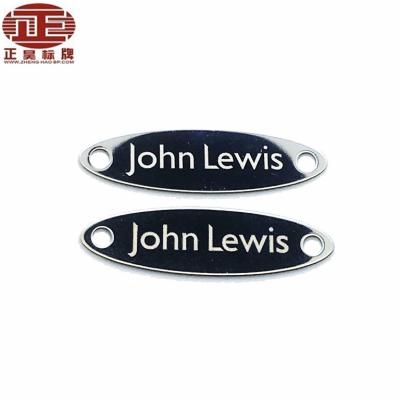 China Custom Europe logo engraved embossed shiny metal tags for sale