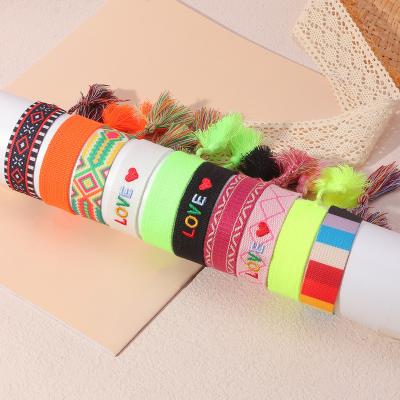 China Colorful BOHEMIA Style Letter Embroidery Bohemian Manual Tassel Woven Bracelets Friendship Bracelet Colorful Bracelet for sale