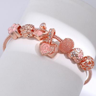 China Best Selling FASHIONABLE Enamel Flower Cavity Beads Charm Bracelet Lobster Clasp Rhinestone Flower Heart Charm Bracelet for sale