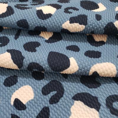 China Tear-resistant Most New Fashion Jacquard Design Bullet Printing Bubble Knit Fabric For Bows for sale