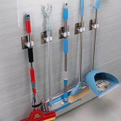 China Behind Doors/On Walls Wipe Organizer Wall Mounted Mop Storage Rack Tool Hanger Broom Broom Holder Self-adhesive Storage Holders Handle for sale