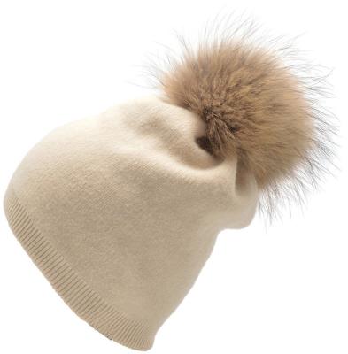 China breathable & Waterproof Women's Sheer Cashmere Beanie Hat Raccoon Fur Ball Knit Beanie Slouchy Hat Custom for sale