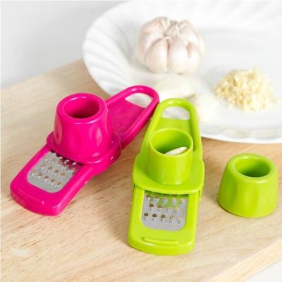 China Kitchen Accessories Viable Color Candy Color Candy Plastic Ginger Garlic Grinding Tool Magic Silicone Peeler Cutter Grater Planer for sale