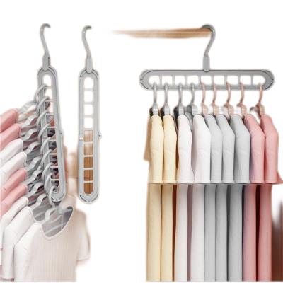 China Behind Doors/On Walls New Listing Plastic Hanger Drying Rack Rotatable Coat Clothes Folding Hangers Space Saving Multi Layer Collapsible Hanger for sale