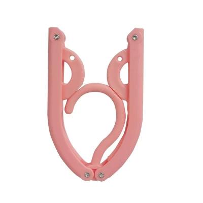 China Behind The Doors/On Walls Factory Direct Sale Foldable Pants Hanger Space Saving Magic Plastic Hangers for sale