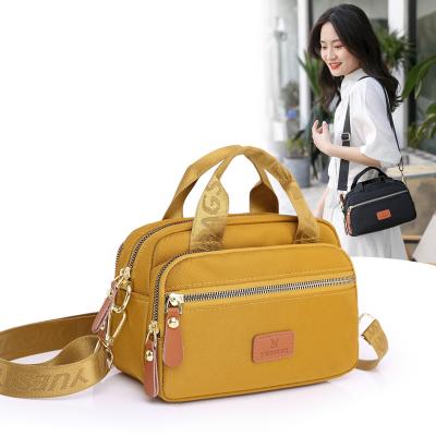 China 2022 summer newsolid color waterproof stylish cross-body bag with leather handheld square shoulder bag for women for sale