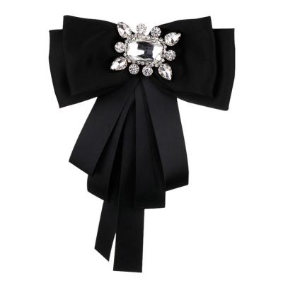 China Fashion Jewelry Delicate Fabric Women Brooch Corsage Black And White Ribbon For Lady Gift Crystal Butterfly Brooch for sale