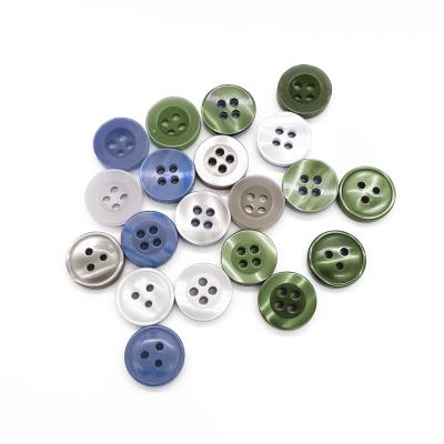 China Basic Round Button Sew Roll Shape 4 Holes Polyester Resin White Black Plastic Plastic Shirt Button for sale