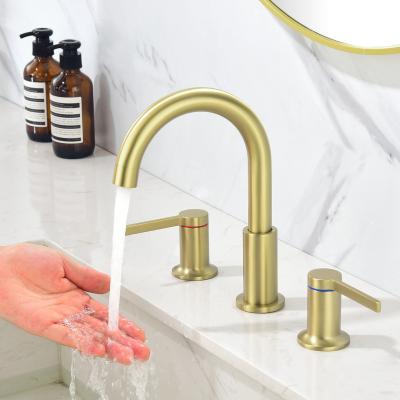 China Metered Faucets 2 Handles Brass Gold Bathroom Sink Faucet 3 Hole Basin Cold Water Sink Faucets Hot with Aerator for sale