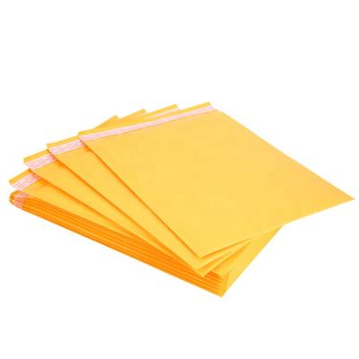 China Holographic Kraft Envelope Mailers Shipping Packaging Bubble Mailers With Logo for sale