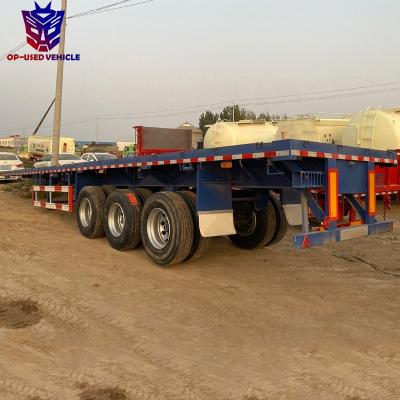 China 3 Axle Semi Truck Trailer Used Flat Bed Trailers 60 Tons Loading Flatbed Transport Container for sale