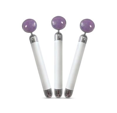 China Lift Up Skin Round Ball Shape Amethyst Electric Face Massage Roller for sale