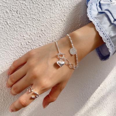 China Lead Free Nickel OT Asymmetrical Design Buckle 925 Sterling Silver Heart Bracelet Solid Sterling Silver Bead Chain Heart Bracelet For Women for sale