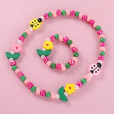 China Elegant. handsome. fashion. Beautiful Children's Colorful Wooden Beads Butterfly Flower Bracelet Necklace Kids and Iridescent Acrylic Pendant Children's Bracelets for sale