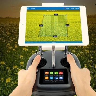 China Carbon fiber 10L payload UAV drone sprayer agricultural machine and drone remote controller DK32 for sale