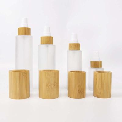 China Wholesale 30ml 50ml 60ml 80ml 100ml 120ml Cosmetic Cylinder Shape Bamboo Frosted Glass Lotion Pump Bottle for sale