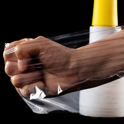 China Free Sample Plastic LLDPE Roll Wrap Package Hand Wrap Plastic Stretch Film With Handle Mini Black Stretch Film for sale