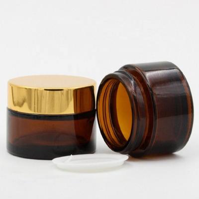 China 5ml 0.17 Amber Glass Round Jars Cosmetic Container Bottles With White Inner Layers And Sliver Black Lids Glass Jars for sale