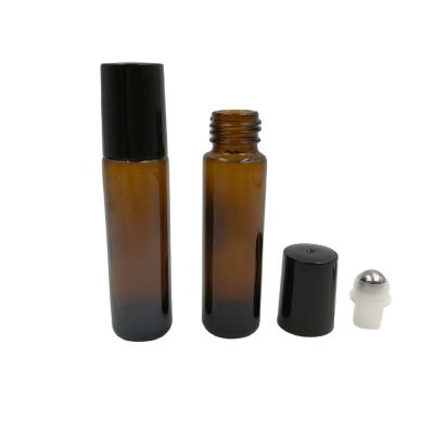 China 10ml Cosmetic Amber Roll On Bottles For Essential Oils Perfume 0.3oz Empty Glass Roll On Bottle With Black Lid for sale