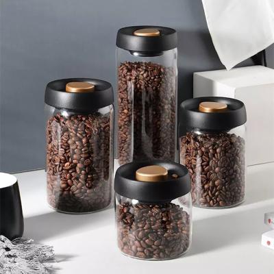 China Sustainable Glass Food Storage Jars with Black Lid for Serving Tea Coffee Flour Sugar Candy Cookie Spice Borosilicate Food Canister for sale