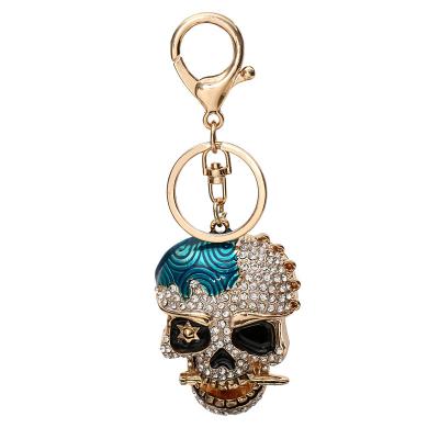 China Decoration Rhinestone Enamel Metal Human Head Key Chain for sale