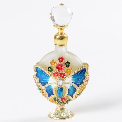 China PERFUME Unique Arabic Style Metal Essential Oil Butterfly Perfume Glass Bottles With Glass Stick for sale