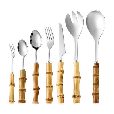 China Viable Hot Selling Wooden Handle Bamboo Flatware Shaped Stainless Steel Steak Knife Fork Measuring Serving Spoon Cutlery Dinnerware Set for sale