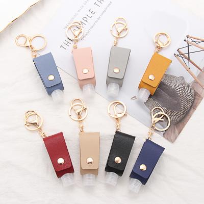 China Free Selectable Matching Matching PU 30ml Travel Refillable Empty Bottles Key Chain Leather Holder Bottle For Portable Hand Soap Dispensers for sale