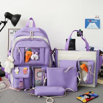 China Cheap Wholesale 2023 factory manufacturer raincoats primary middle school student 4 pieces set backpack school bags for girls for sale