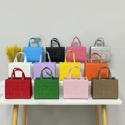 China Fashion Trending New Arrival Embossing Letter Protect Purses And Color Women Handbags Ladies Handbags for sale