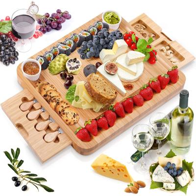 China Wholesale Custom Bamboo Wood Cutting Plate Kitchenware Cutting Board Viable Cheese Cutting Board with Knife Set Ambient for sale