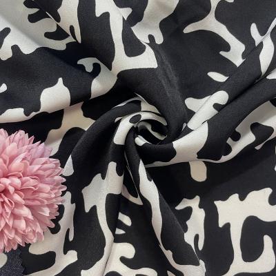 China Black pure color floral factory pattern stretch satin fabric for making women's dress sleepwear costume fabric for sale