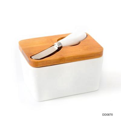 China Sustainable Ceramic 450ml Butter Dish With Knife Porcelain Butter Container With Bamboo Lid for sale