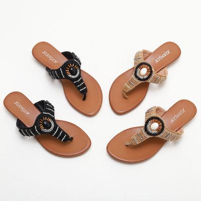 China BS162 588-1 Flip-On Beach Shoes Slippers New Summer Fashion Outer Wearing Seaside Ethnic Wind Slope With Rhinestone Sand for sale