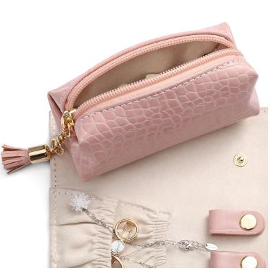 China Very Popular Jewelry Organizer and Functional PU Leather Jewelry Bag Organizer Custom Logo Jewelry Pouch with Tassel for sale