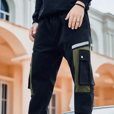 China Hot Sales QUICK DRY Custom Multi Pocket Men's Black Elastic Waist And Leg Jogger Pants For Men for sale