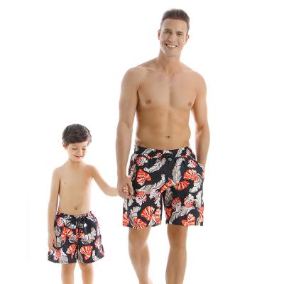 China 2021 new parent-child printing red and green breathable bikini men's swimming trunks slit swimwear bikini men's swimming trunks children's shorts for sale